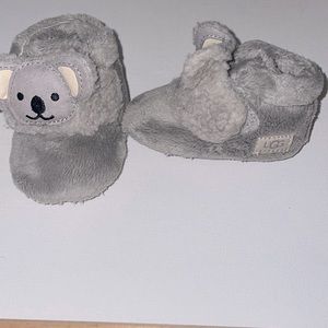 Gray infant UGG booties with koala bear